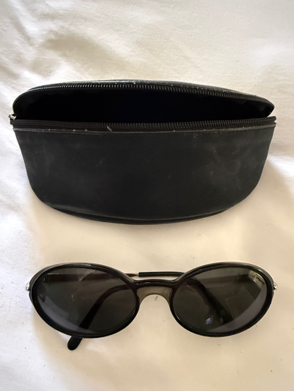 Cartier Black Oval Sunglasses with Black Zip Case